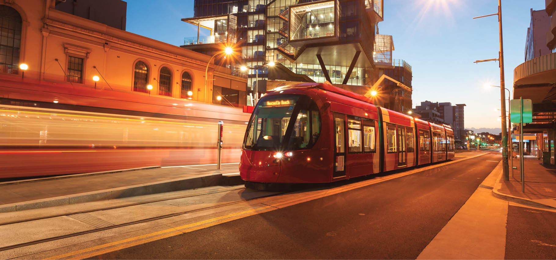 Newly installed light rail in Newcastle CBD Australia  Illuminated at dusk 